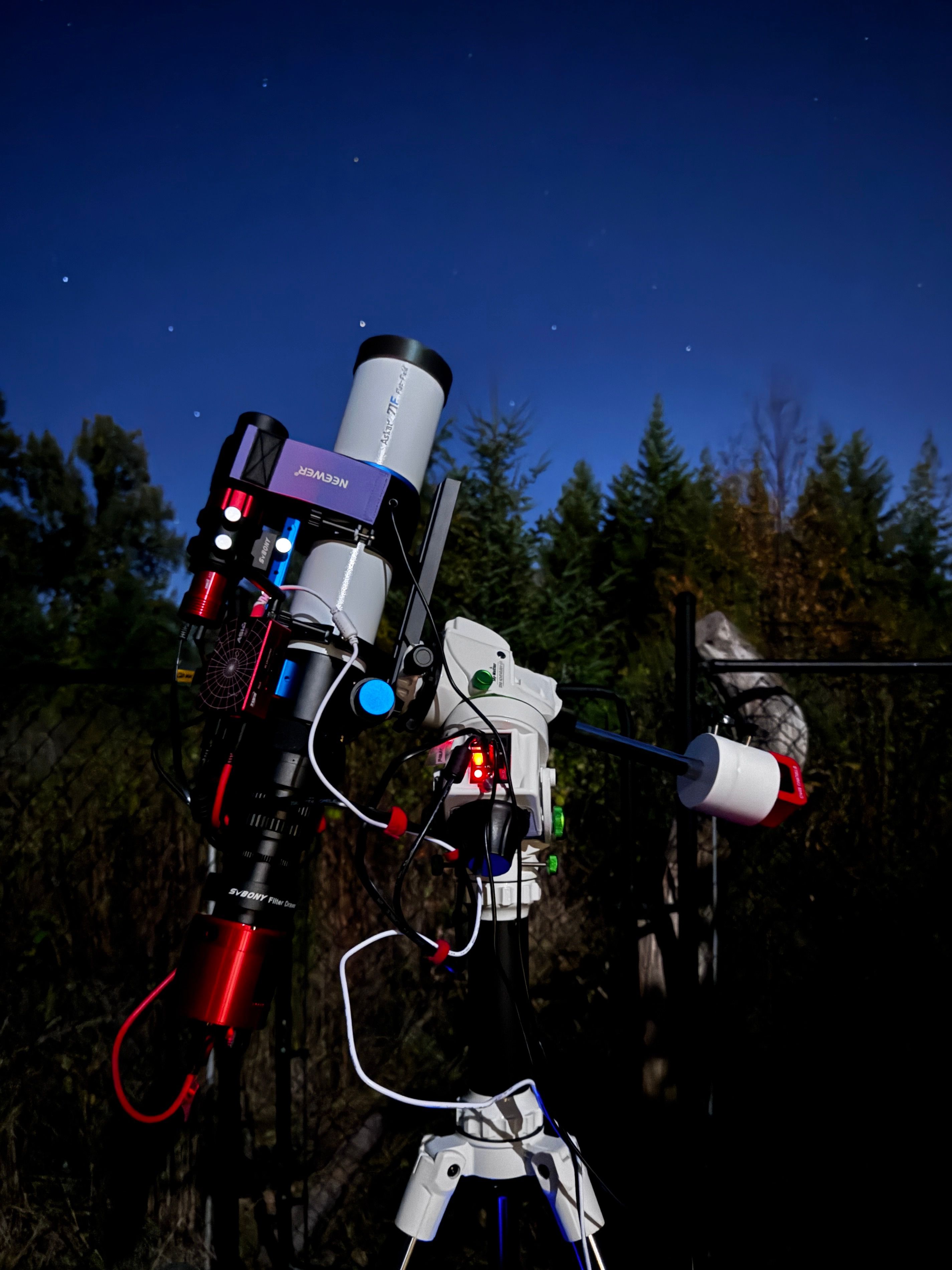 Astrophotography telescope rig set up under night sky